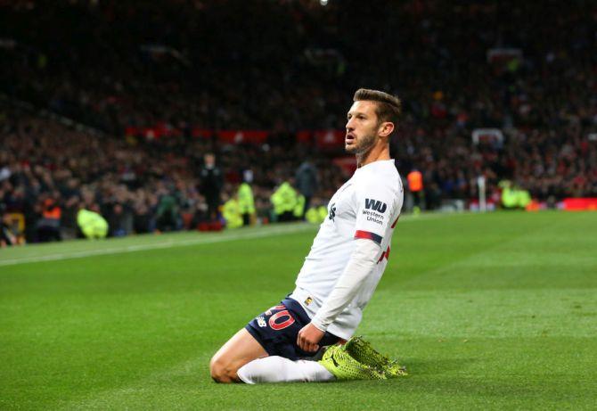 Liverpool's Adam Lallana celebrates after scoring the equaliser against Manchester United