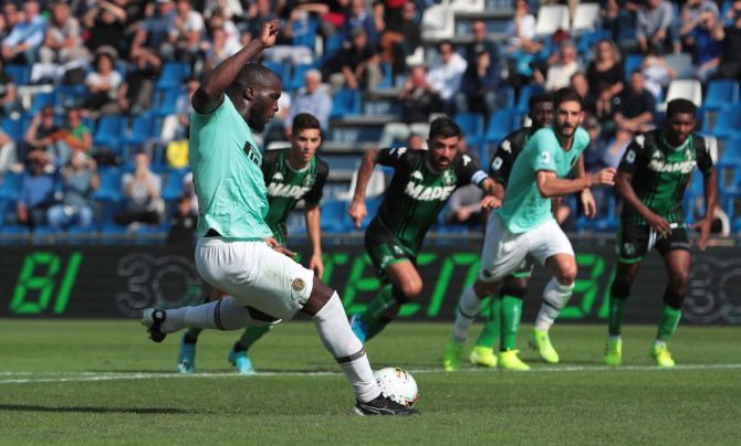 FC Internazionale's Romelu Lukaku scores to convert a penalty to score the team's second goal against US Sassuolo