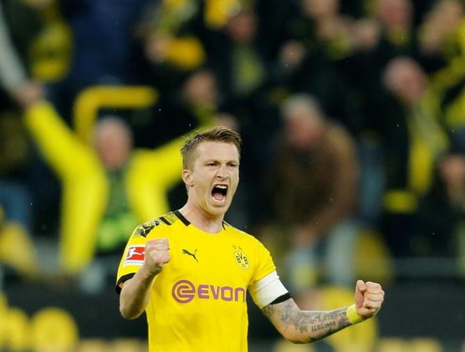 Borussia Dortmund's Marco Reus celebrates at the end of Saturday's Bundesliga match against Borussia Moenchengladbach.