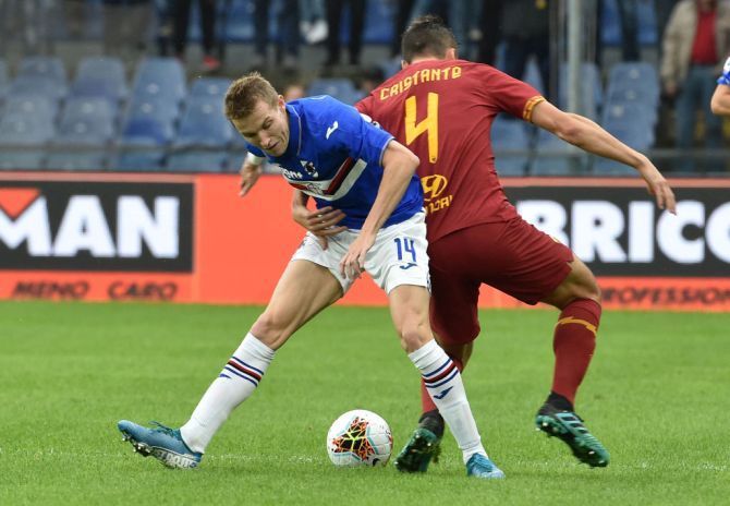 UC Sampdoria's Jakub Jankto battles for the ball with AS Roma's Bryan Cristante during their Serie A match at Stadio Luigi Ferraris in Genoa, Italy, on Sunday