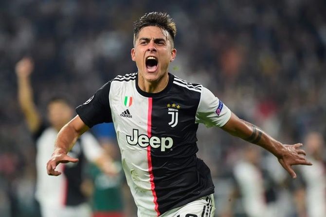 Paulo Dybala celebrates scoring Juventus's second goal in the Group D match against Lokomotiv Moscow