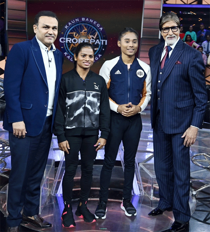 Virender Sehwag, Dutee Chand and Hima Das with Amitabh Bachchan while shooting for an episode of Kaun Banega Crorepati