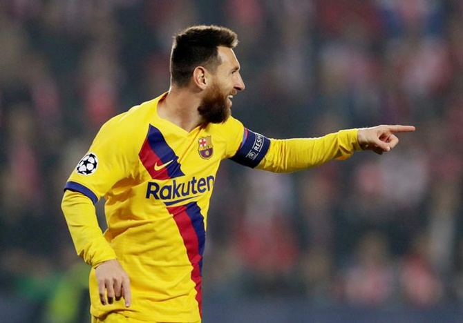 Lionel Messi celebrates scoring Barcelona's opening goal in the Champions League Group F match against Slavia Prague