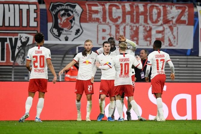 Marcel Sabitzer, centre, celebrates scoring Leipzig's second goal