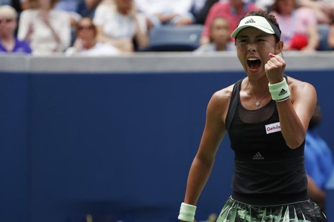 Qiang Wang reacts after winning a point against Ashleigh Barty.