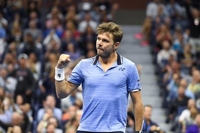 Stan Wawrinka reacts after winning the first set against Novak Djokovic.