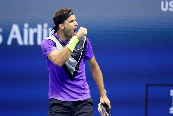 Bulgaria's Grigor Dimitrov celebrates after winning the second set during his quarter-final match against Switzerland's Roger Federer on day nine of the 2019 US Open at the USTA Billie Jean King National Tennis Center at Flushing Meadows in the Queens borough of New York City on Tuesday