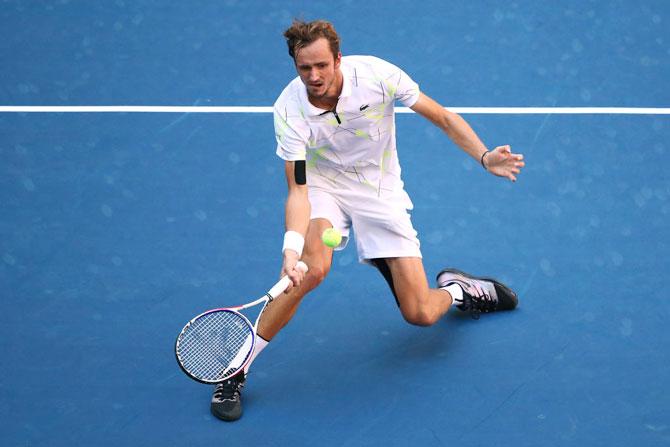 Russia's Daniil Medvedev returns a shot during his quarter-final against Switzerland's Stan Wawrinka