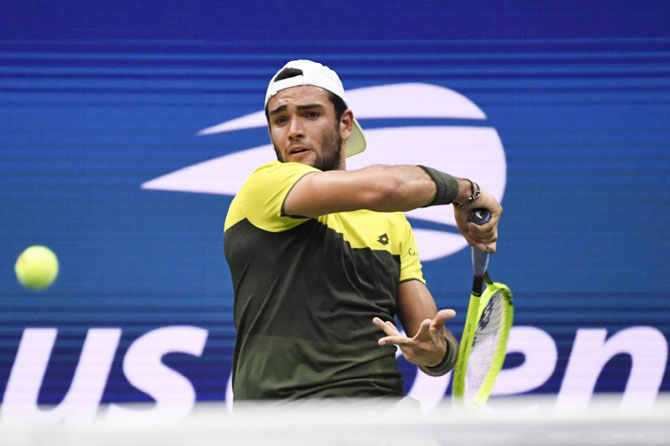 Italy's Matteo Berrettini plays a return against France's Gael Monfils in the quarter-finals on day ten of the 2019 US Open tennis tournament at USTA Billie Jean King National Tennis Center at Flushing Meadows on Wednesday