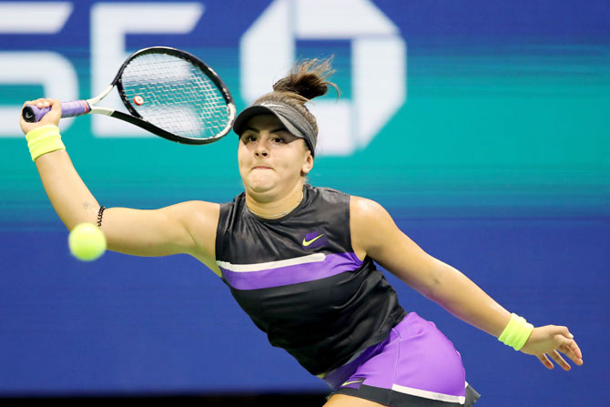 Canada's Bianca Andreescu returns a shot against Belgium's Elise Mertens