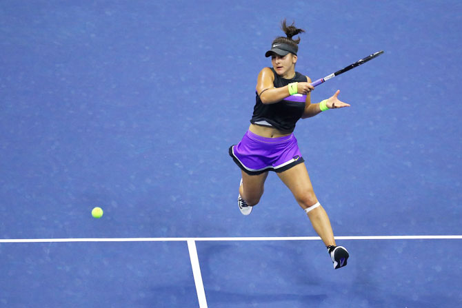 Bianca Andreescu returns a shot against Belinda Bencic