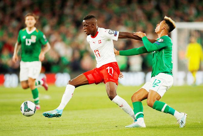 Republic of Ireland's Callum Robinson in action with Switzerland's Denis Zakaria during their Euro 2020 Qualifier Group D match at Aviva Stadium, Dublin, Ireland on Wednesday