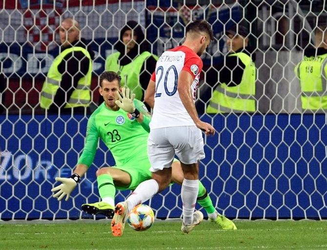 Bruno Petkovic scores Croatia's third goal.