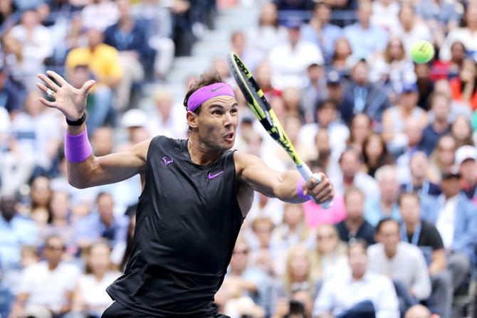 Rafael Nadal plays a return against Daniil Medvedev.