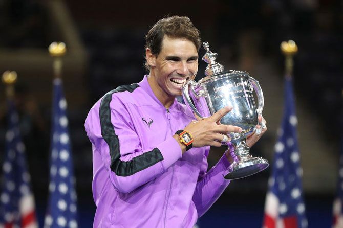 Rafael Nadal celebrates with the championship trophy during the trophy presentation ceremony after winning te US Open final against Daniil Medvedev