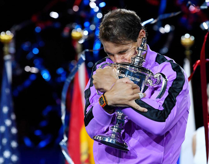 Rafael Nadal celebrates with the championship trophy after beating Daniil Medvedev in the US Open final on Sunday