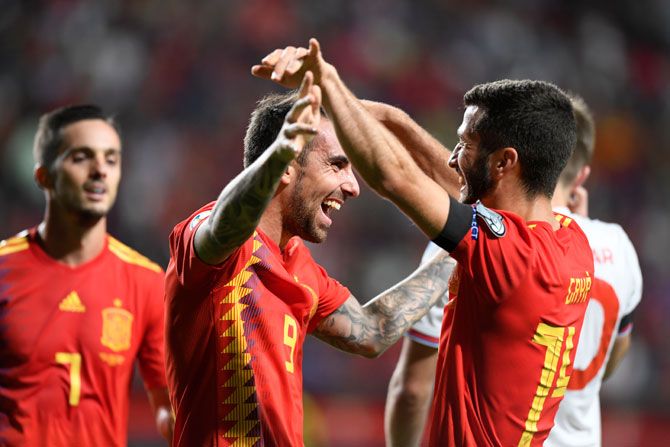 Spain's Paco Alcacer celebrates with Jose Gaya after scoring their fourth goal