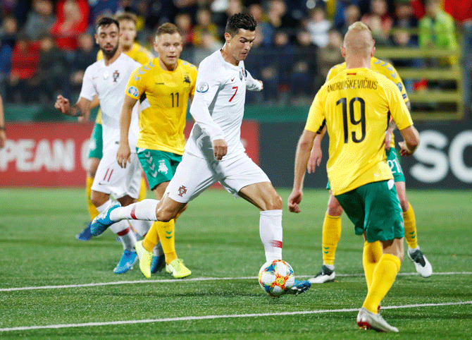 Portugal's Cristiano Ronaldo shoots during the Euro 2020 Qualifier Group B match against Lithuania at LFF Stadium, in Vilnius, Lithuania on Tuesday