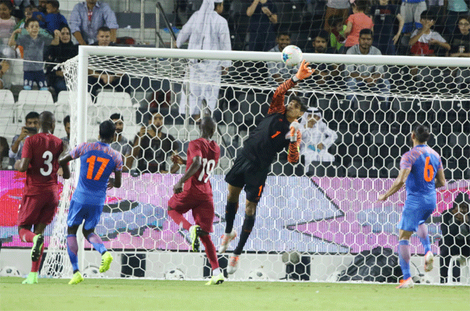 India keeper Gurpreet Singh Sandhu puts in a good effort to deny the Qataris