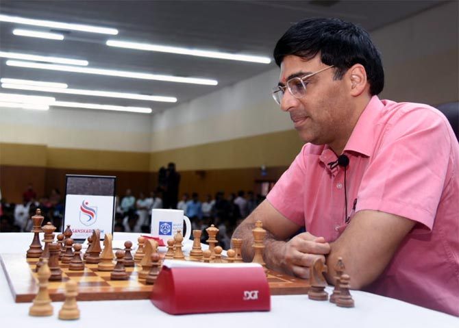 PIX: Vishy Anand celebrates International Chess Day with son - Rediff.com