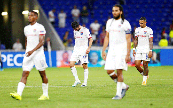 Olympique Lyonnais players wear a dejected look after the match match in their Group G match against Zenit Saint Petersburg at Groupama Stadium, Lyon