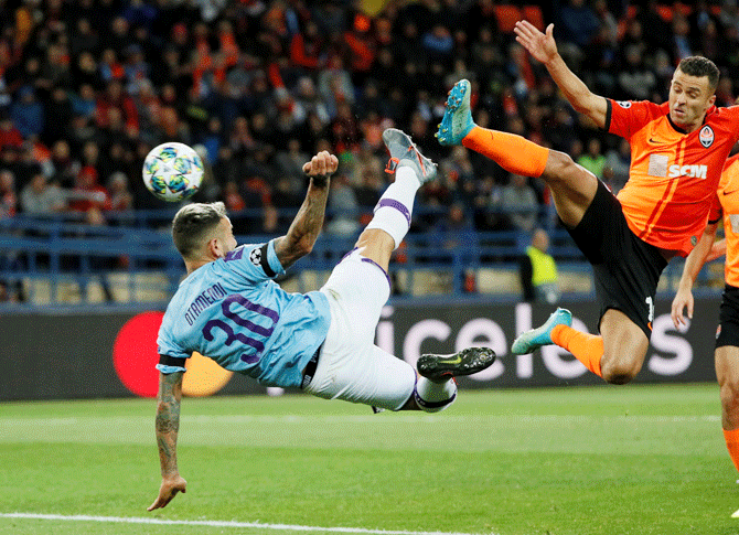 Manchester City's Nicolas Otamendi in action with Shakhtar Donetsk's Junior Moraes during their Champions League Group C match at Metalist Stadium in Kharkiv, Ukraine