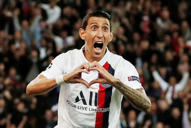 Paris St Germain's Angel Di Maria celebrates scoring their first goal against Real Madrid in their Champions League Group A match at the Parc des Princes in Paris on Wednesday