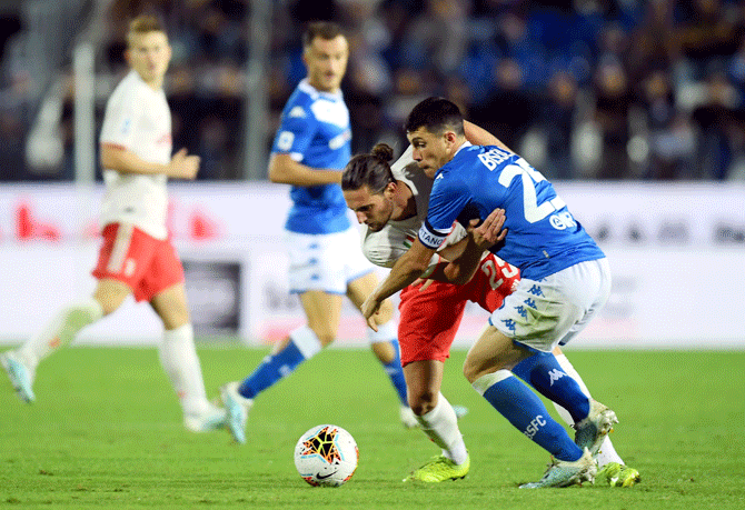 Juventus' Adrien Rabiot and Brescia's Leonardo Morosini vie for possession 