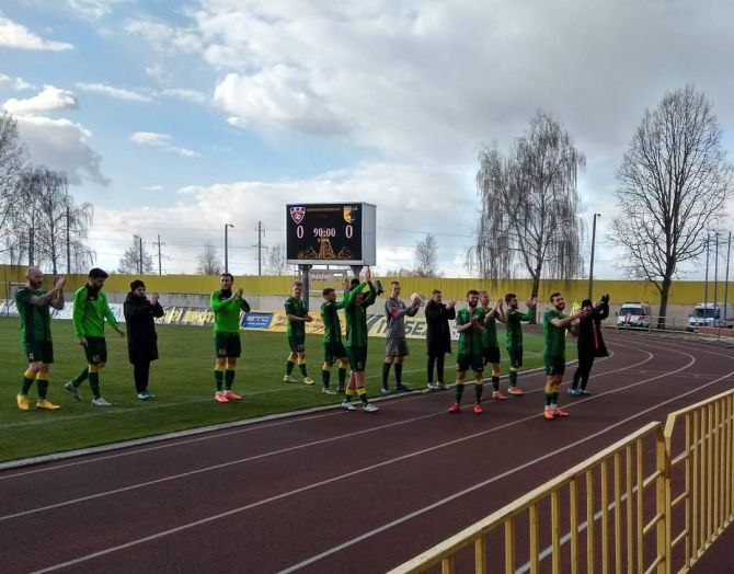 FC Neman Grodno players applaud to empty stands after their match against FC Shakhtyor Soligorsk last weeek.