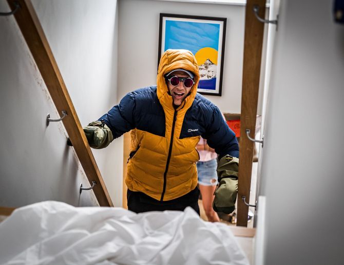 Former professional rugby player and quadriplegic, Ed Jackson, is seen as he attempts to climb the height of Mount Everest up his staircase at home to raise money for Wings for Life - a spinal cord research foundation, in Bath, Britain, in this handout image taken on Friday