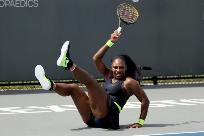 Serena Williams falls to the court as she plays a forehand return during her match against Bernarda Pera on Day 2 of the Top Seed Open at the Top Seed Tennis Club in Lexington, Kentucky, on Tuesday