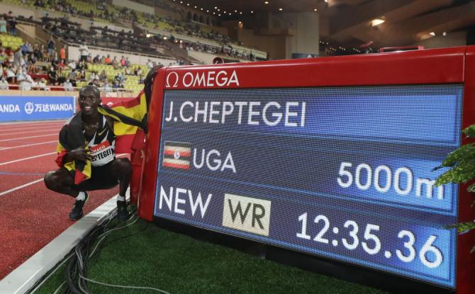 Uganda's Joshua Cheptegei celebrates after winning the men's 5000m and setting a new world record at the Diamond League at Stade Louis II, Monaco, on August 14, 2020