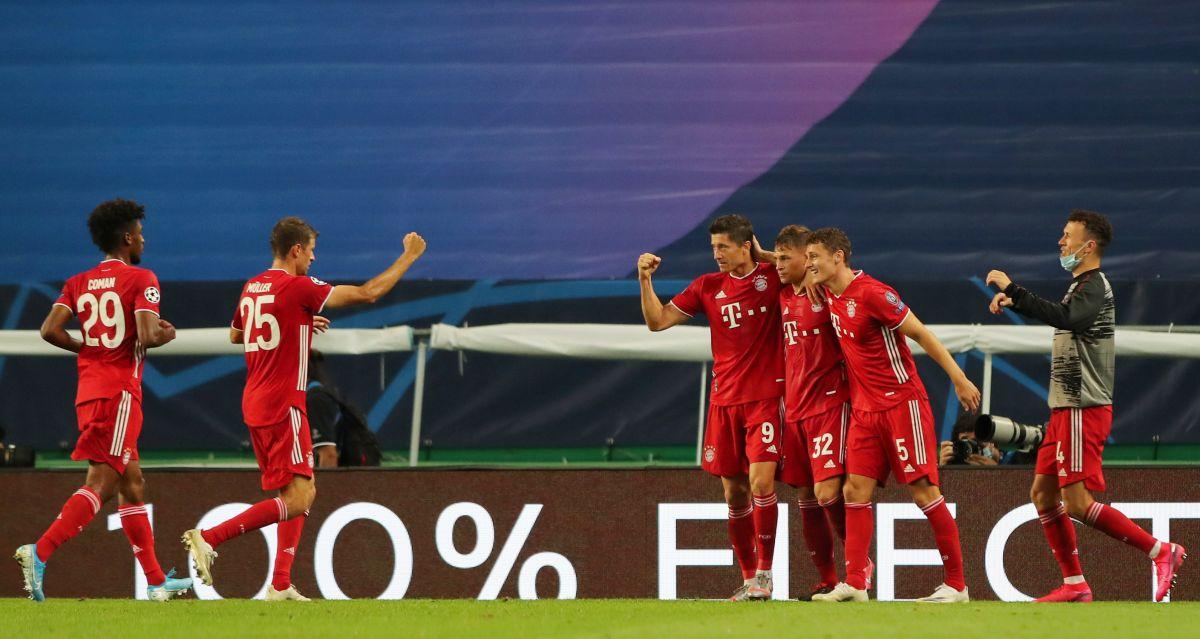 Bayern Munich's Robert Lewandowski celebrates with teammates on scoring their third goal