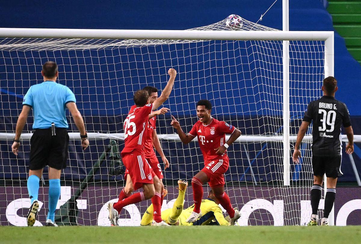 Bayern Munich's Serge Gnabry celebrates with teammates Robert Lewandowski and Thomas Mueller after scoring his team's second goal