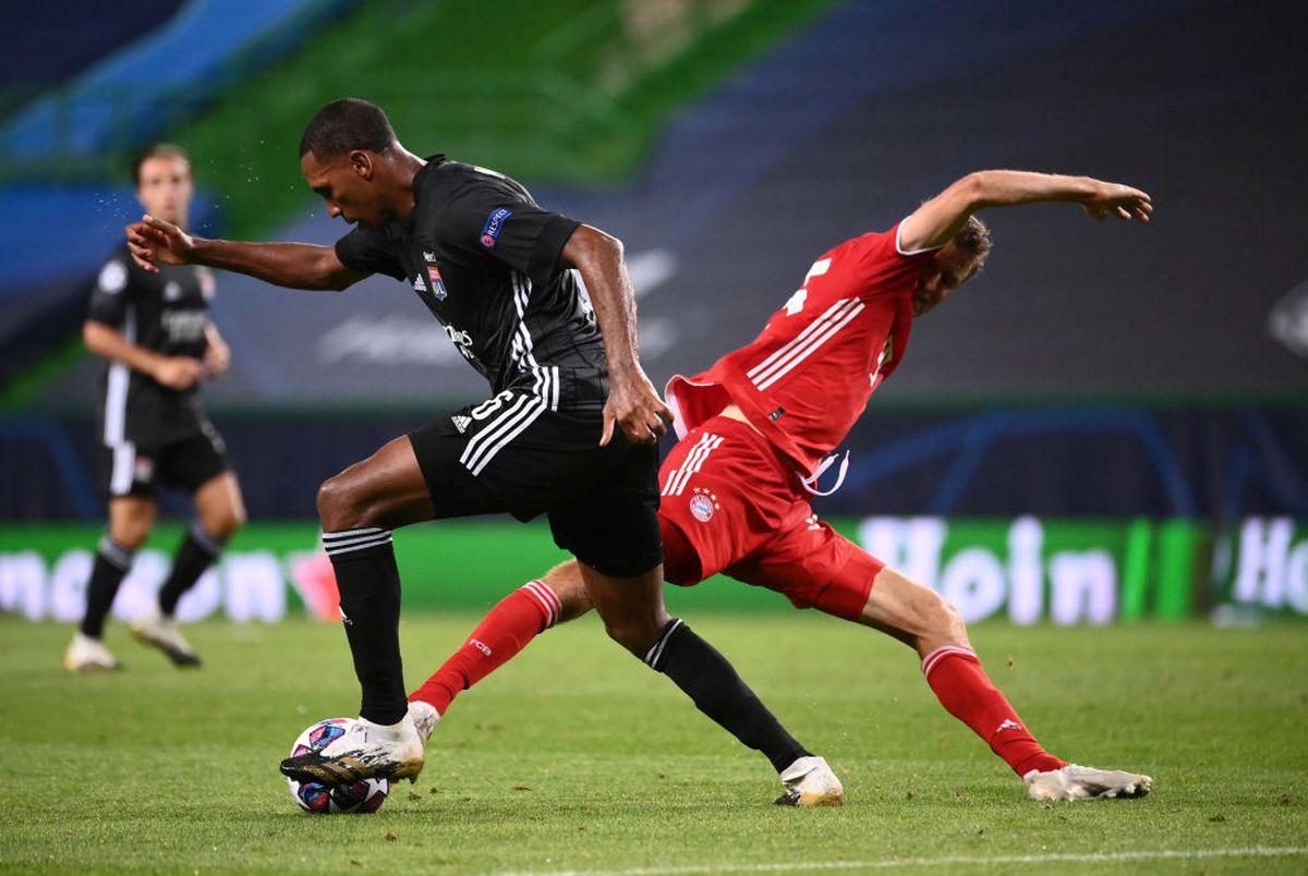 Olympique Lyonnais' Marcelo  battles for possession with Bayern Munich's Thomas Mueller