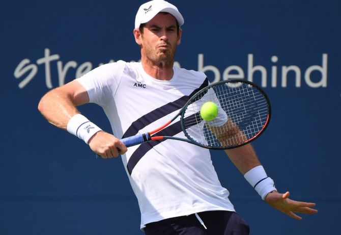 Andy Murray plays a return against Frances Tiafoe during the Western & Southern Open at the USTA Billie Jean King National Tennis Center at Flushing Meadows in New York on Saturday