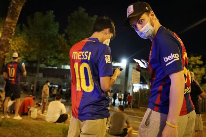 FC Barcelona and Lionel Messi fans gather outside Camp Nou on Tuesday 