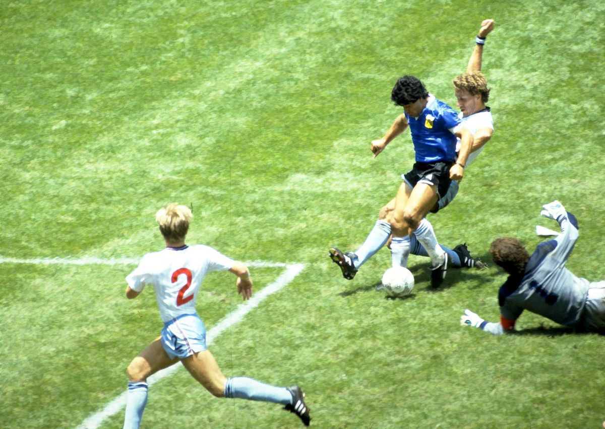 Argentina's Diego Maradona scores during the 1986 World Cup quarter-final against England at Azteca Stadium in Mexico City on June 22, 1986.