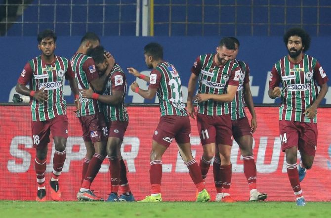 Players celebrate with Roy Krishna after he scores the late winner for ATKMB in their match against Odisha FC at Fatorda Stadium in Goa on Thursday  