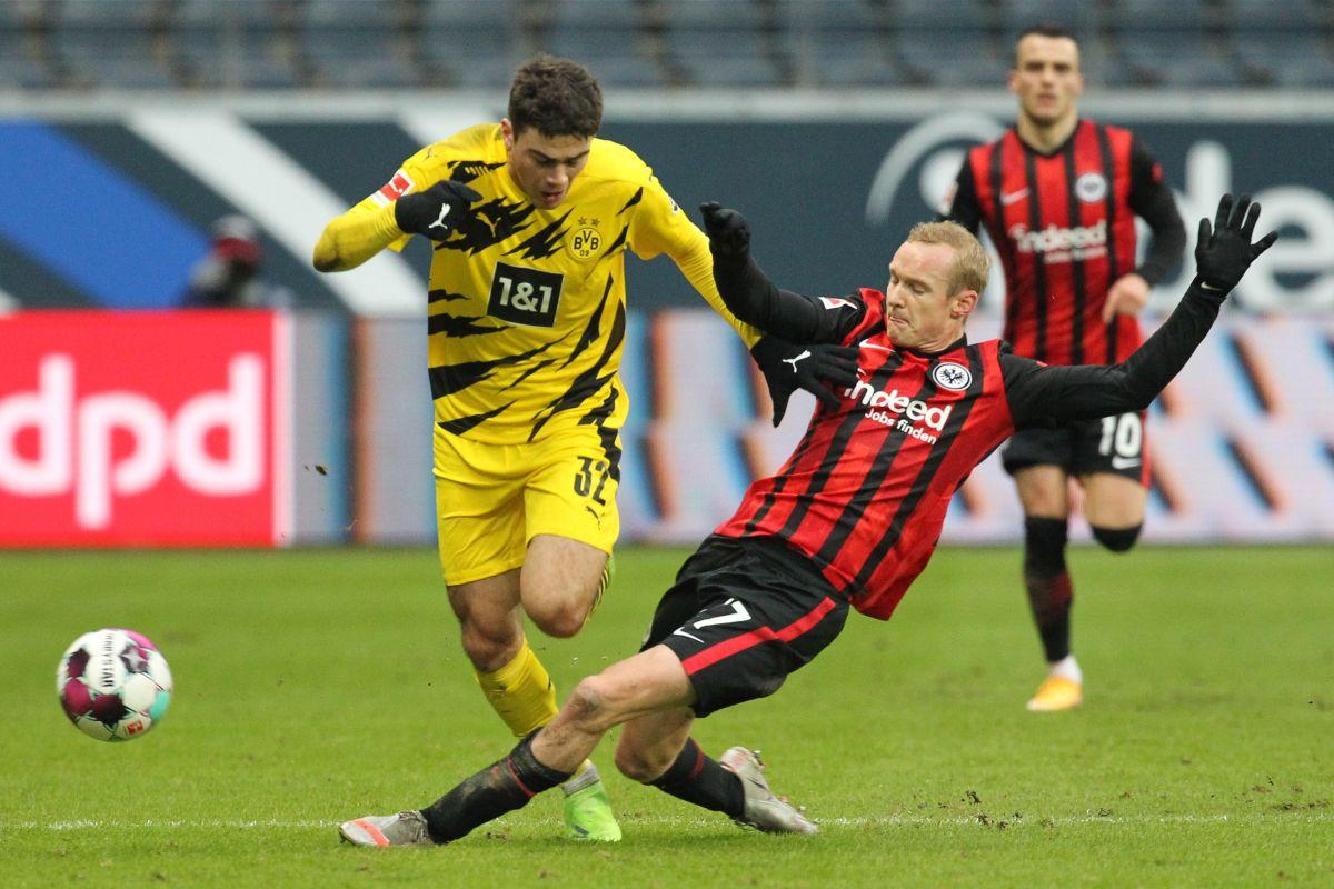 Eintracht Frankfurt's Sebastian Rode in action with Borussia Dortmund's Giovanni Reyna during their Bundesliga match at Deutsche Bank Park, Frankfurt, on Saturday 