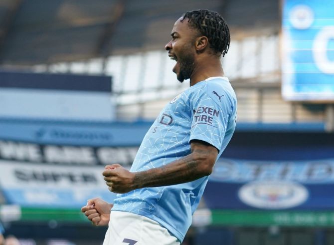 Manchester City's Raheem Sterling celebrates scoring their first goal against Fulham at the Etihad Stadium in Manchester on Saturday