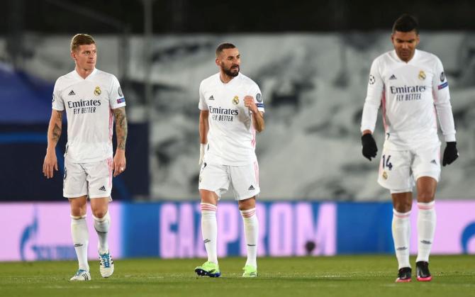 Karim Benzema (centre) celebrates after scoring their team's second goal against Borussia Moenchengladbach