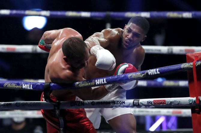 Anthony Joshua punches Kubrat Pulev during their Heavyweight World Title Boxing Fight at The SSE Arena in London on Saturday 