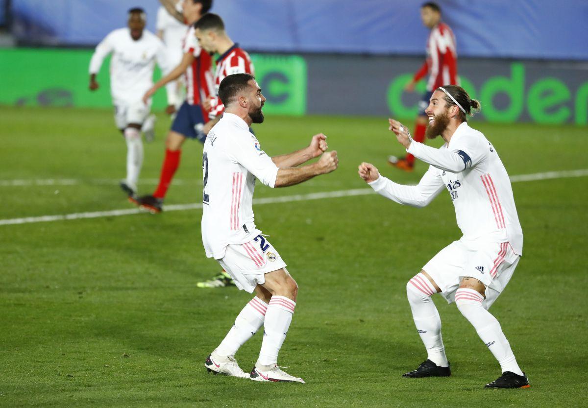 Real Madrid's Dani Carvajal celebrates with Sergio Ramos after Atletico Madrid's Jan Oblak scores an own goal during their La Liga match at Estadio Alfredo Di Stefano, Madrid on Saturday