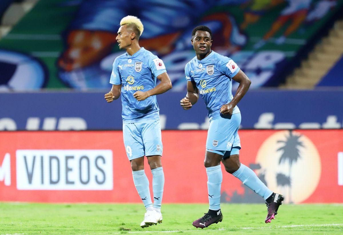 Mumbai City FC's Bipin Singh and Bartholomew Ogbeche celebrate on scoring the equaliser against Jamshedpur FC during their ISL match at GMC stadium in Bambolim, Goa, on Monday.