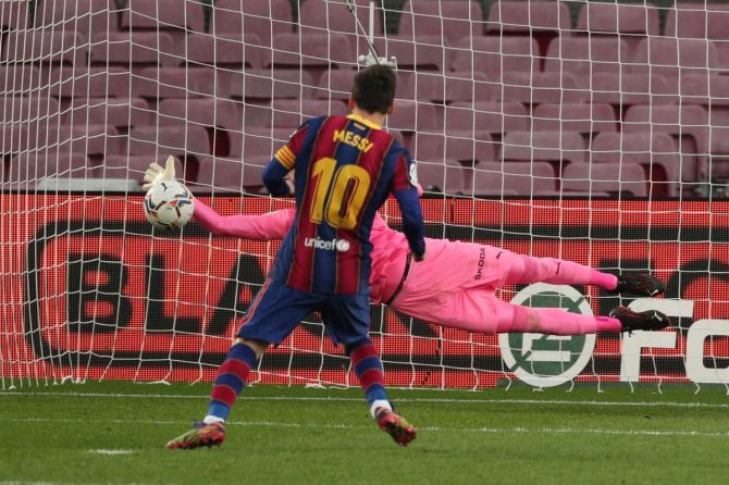 FC Barcelona's Lionel Messi misses a penalty from the spot during their La Liga match against Valencia at Camp Nou