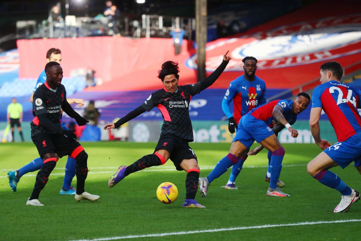 Liverpool's Takumi Minamino scores the opening goal.