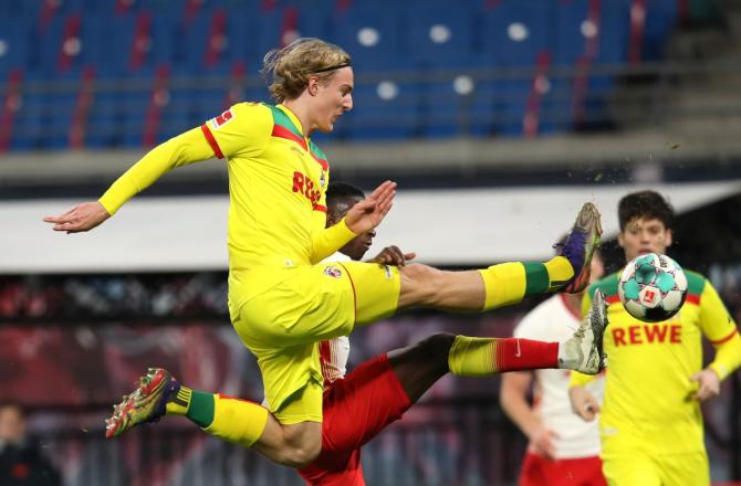 FC Cologne's Sebastiaan Bornauw in action with RB Leipzig's Amadou Haidara as they vie for possession during their Bundesliga match at Red Bull Arena, Leipzig, Germany