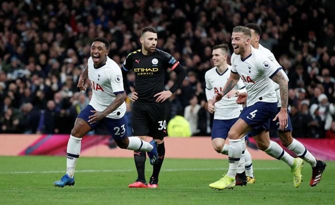 Steven Bergwijn, left, celebrates scoring Tottenham Hotspur's first goal with Toby Alderweireld in Sunday's Premier League match against Manchester City.