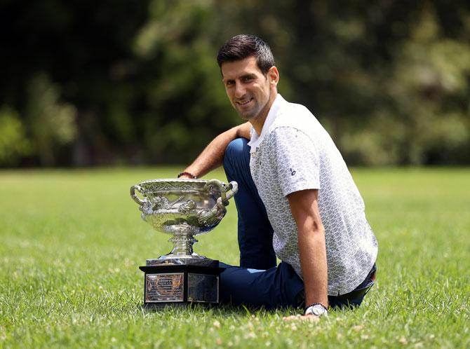 Novak Djokovic poses during the 2020 Australian Open Men's Trophy. The Australian Open, which started in January, has so far been the only Grand Slam that was not impacted in 2020 with the French Open organisers moving the claycourt major back to September from its May start.